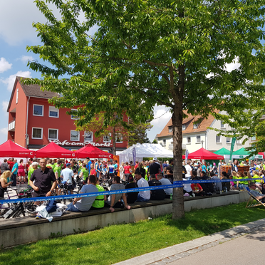 Red 3x3m gazebo, green 3x3m gazebo and white 6x3m gazebo at a folk festival in Germany